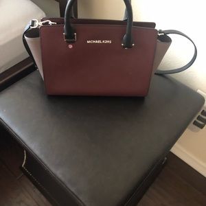 Michael kors maroon purse.